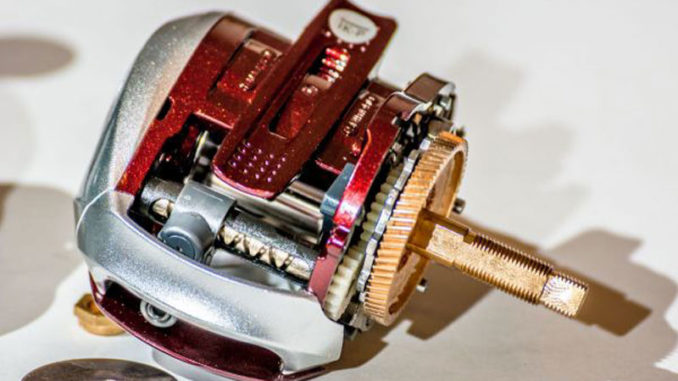 You can use some Simple Green solvent and a toothbrush to clean the pawl/worm gear.