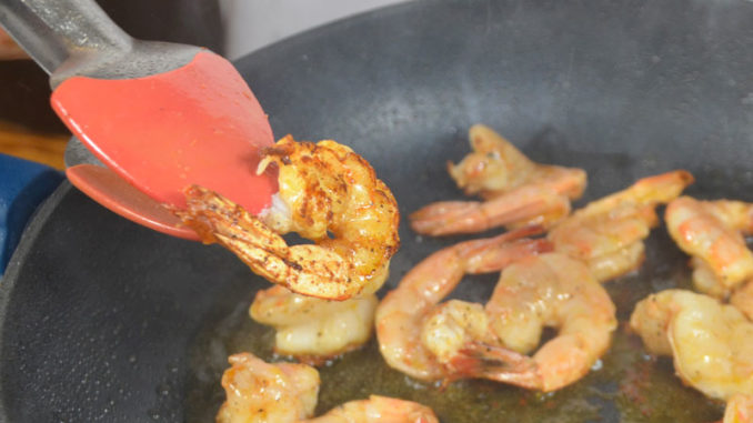 The secret to Bronzed Shrimp is searing the outsides of the shrimp over very high heat without burning the insides.