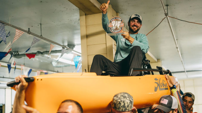Devon Beltz gets the traditional ride in his new kayak as the winner of BCKFC’s Fall ’N Tide kayak fishing tournament.