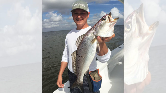 Chris Lake holds a nice Lake Decade speckled trout.