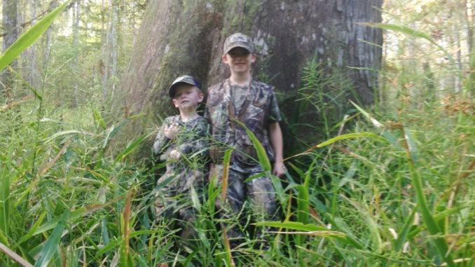 William and John Guidry enjoyed their squirrel opening day outing on Pearl River WMA. This cypress tree is one of the giants left around from the good old days.