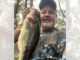Mike “Pickle” Fontenot of Ville Platte holds one of the hawgs he has caught fishing Chicot Lake.