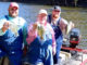 The Maxwells in official fishing clothing along with “Team Overalls” boat logo and all.