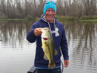 Barry Henry smiles as he holds a nice-sized bass caught on a cold winter’s day in the Crackerhead area of Lake Verret while fishing with Bill McCarty of Morgan City.