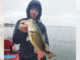 Curt Crool’s son proudly holds a nice-sized bass, one of 35 he caught while working a suspending gold/orange Rogue on a bitterly cold January day with John Dean at Toledo Bend.