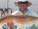 Scott Baker of Arkansas shows off a nice red caught with Smokin’ Reels Charters out of Lydia.