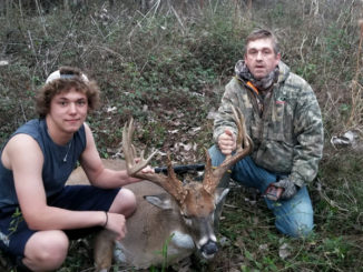 Scotty Smith, right, and his son Hunter take a picture after Scotty dropped this 190-class typical buck in Avoyelles Parish on Jan. 1.