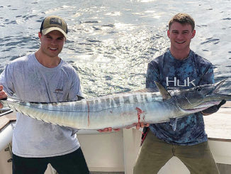 Tyler Hatrel, right, and Keaton Biggs pose with a nice wahoo they reeled in earlier this year while trolling shaky baits south of Fourchon.