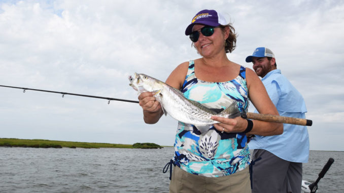 Bogalusa Representive Malinda Brumfield- White and son Parker catch fish in a deep drop off along Coup Abel Pass.