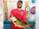 Garrett Perkins, of Mamou, poses with the big 10.46-pound bass he caught from a bed on March 25 in the Negreet area at Toledo Bend. The big fish finally bit a Texas-rigged white Cajun Lures Craw after about 25 or 30 flips, he said. (Photo courtesy of Toledo Bend Lake Association)