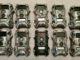 This photo shows 10 trail cameras — nine the author painted himself and one unpainted.