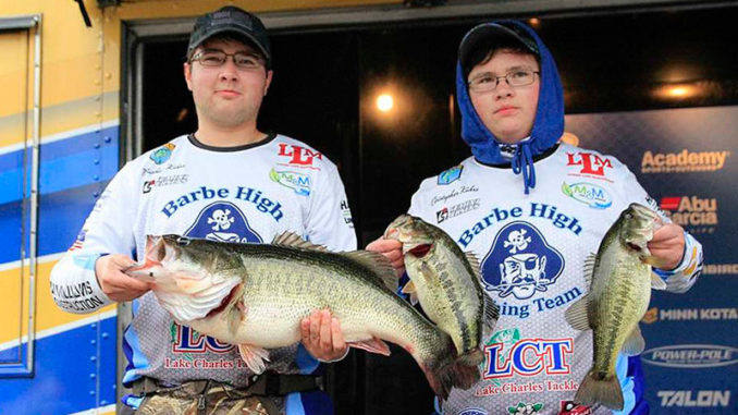 Matthew Kahrs (left) displays his 10.9-pound Toledo Bend lunker, while his brother, Christopher, holds up two other bass taken Jan. 26 during the 2020 Mossy Oak Fishing Bassmaster High School Series event at Toledo Bend. The brothers placed second in the tournament with three bass weighing 15.6 pounds. (Photo courtesy of Ronnie Moore/B.A.S.S)