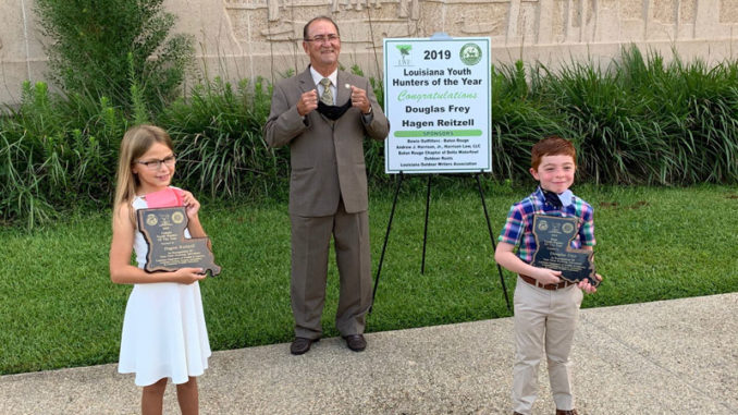 Hagen Reitzell (left), LDWF Secretary Jack Montoucet (middle) and Douglas Frey (right) during the 2019 Youth Hunter of the Year ceremony.