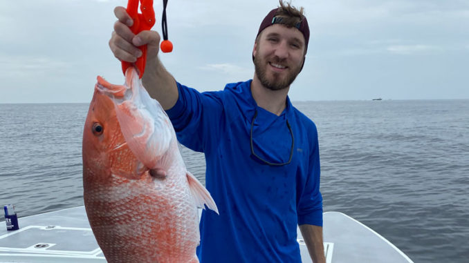 Daniel Kopsco with a red snapper caught out of Port Fourchon on July 4.