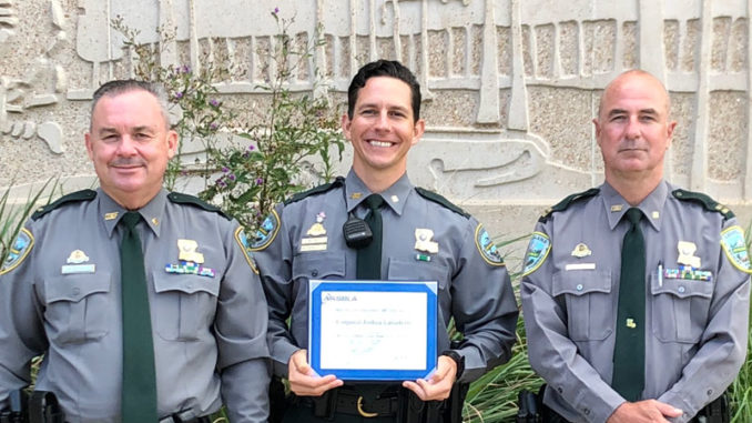 Corporal Joshua Laviolette (middle) with the 2020 NASBLA Boating Law Enforcement Officer of the Year award with Lt. David Nunez (left) and Capt. Stephen McManus.