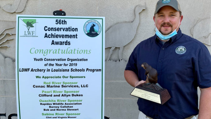 LDWF's Chad Moore, who oversees the Archery in Louisiana Schools program, with the 2019 Youth Conservation Organization award.
