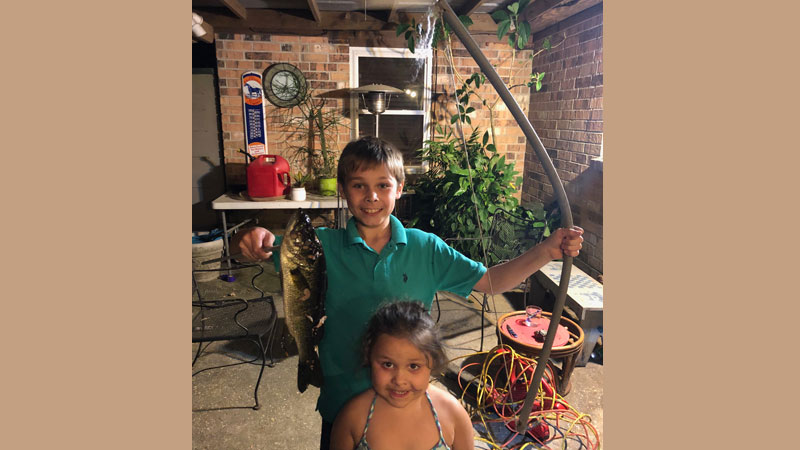 Youth angler Jacob shoots bass with homemade bow