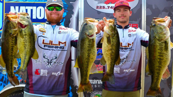 Jacob Andrews, left, and Connor Nimrod show off their outstanding catch, including the big bass of the event, a Caney Lake 11 pounder.