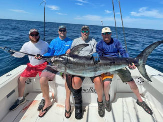 (Left to right) Derrick Dell, Jimmy Brown, William Tucker and Todd Merseal with the big swordfish Dell pulled in.