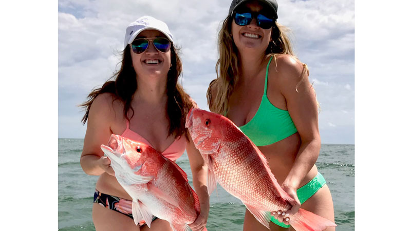 Sisters with red snapper