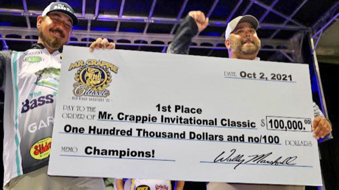 Winners Jeff Larch and Jared Fyock of Arkansas with their $100,000 Crappie Classic championship check.