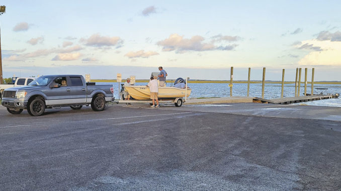 Don’t pull your boat up the ramp, then park it where it is an obstacle to other boaters dropping in or pulling out. Get out of the way before getting ready to leave. (Photo by Brian Cope)