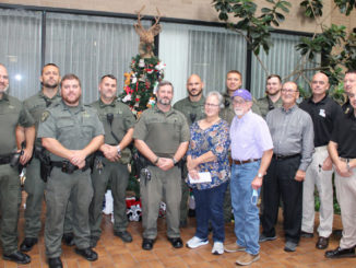 Left to right: Sgt. Channing Duvall, Corporal Brandon Fontenot, Sgt. Allan Marbury, Corporal Jason Sanchez, Corporal Jason Marks, Senior Agent Adam Tieben, Patricial Melancon, Senior Agent Nelson Kennerson, Ronald Melancon, Agent Garrett Kirkland, Sec. Jack Montoucet, Col. Chad Hebert, Lt. Col. Travis Huvall and Major Eddie Skena. (Photo courtesy LDWF)