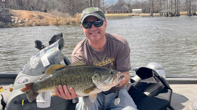 Rudy Rudisill with his 12-4 Cross Lake lunker bass.