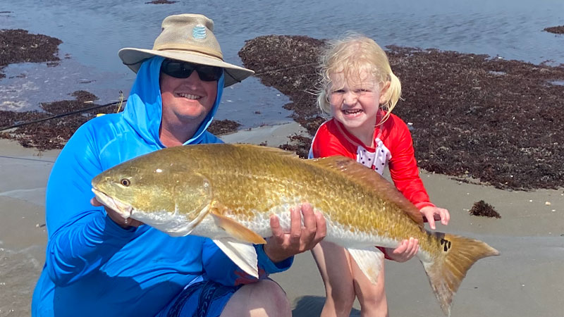 Grace King and her dad, David King, with a large bull red caught off Elmer's Island on May 14, 2022.