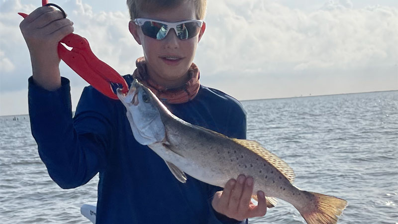 Gavin Seely, 13, got his personal best speckled trout, 19.5 inches, on a Voodoo shrimp under a Four Horsemen cork in Barataria Bay back in May.