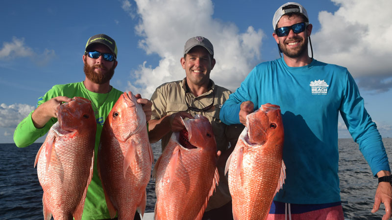 Nick Talley, Matt Geautreau and Lucas Gautreau with some Fourchon red snapper.