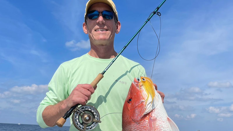 Dr. Kurt O’Brien with a red snapper caught on fly out of Fourchon.