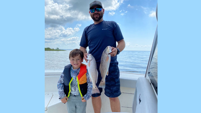 Travis and Thomas Thibodeaux of Lydia with fish caught in East Cote Blanche Bay on June 10.