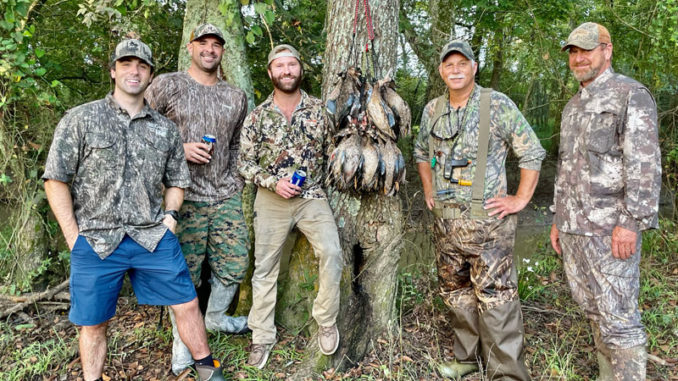 Zach Gassie and his hunting buddies grabbed a quick limit of teal and then kicked back to finish off a great day by telling tales and having fun.