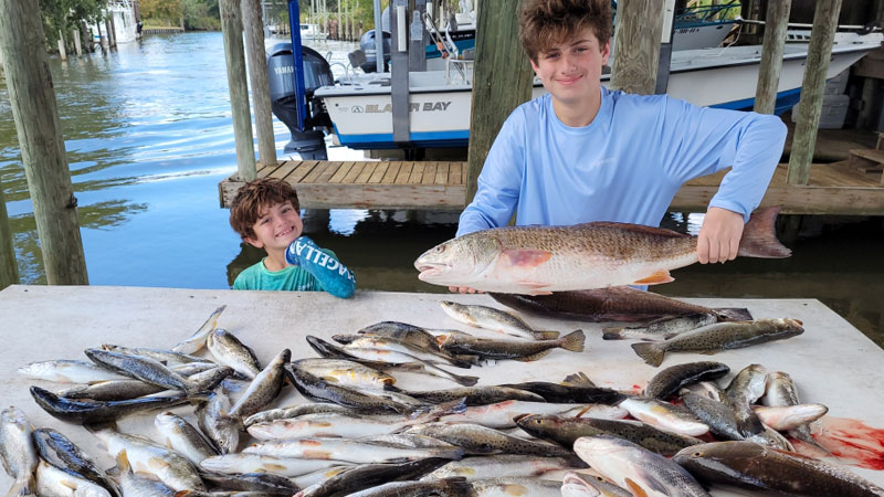 Bryce and Jax fish Shell Beach