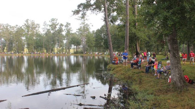 Participants at a past Get Out & Fish! Kick-Off event trying their luck to catch the heaviest catfish! (Photo courtesy LDWF)