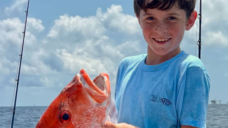 Wil Bass, 9, loves fishing with his uncles, Mike Coullard and Wil Webb.