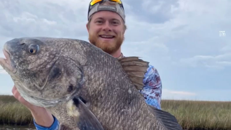Alex Bowling with a big black drum caught out of Hopedale.
