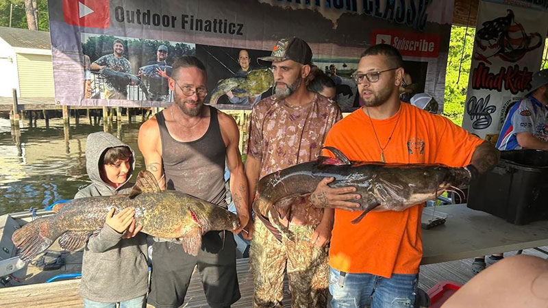 Robert Chavis, Adrian Blanks, Brandon Morton and Gage Morton with the 34-pound flathead and 36-pound flathead.