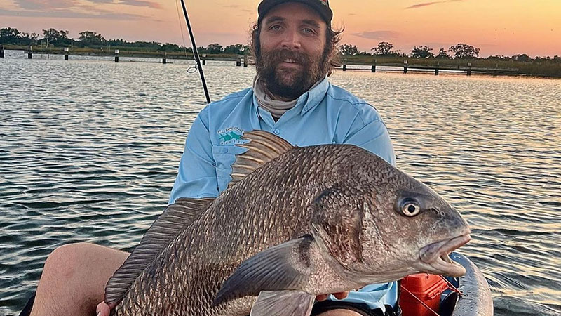 Stephen Pearson with some fish caught from his kayak.