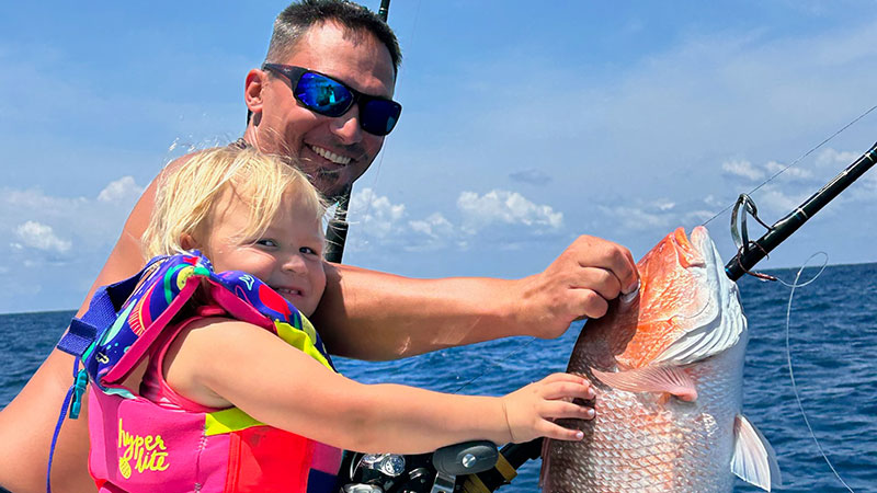 Great start to the opening of snapper season: Simi Fouquier, 3, caught her first snapper while fishing with her dad, Blake Fouquier.