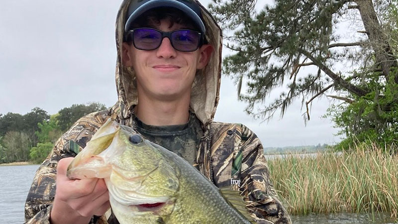 Karson Bourgeois with a bass caught at Indian Creek on March 10.