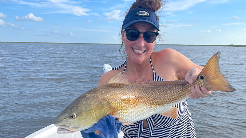 Tammy Bretey with her redfish caught in Lena Lagoon.