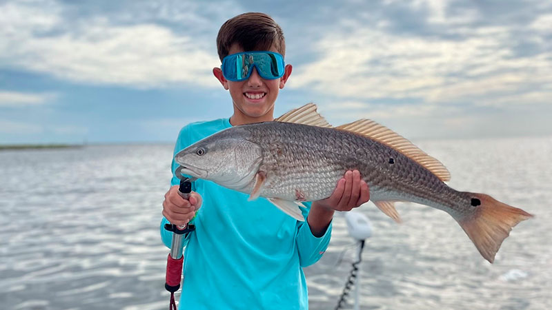 Graham Howard got this redfish with shrimp on the bottom during his 11th birthday trip to Shell Beach.