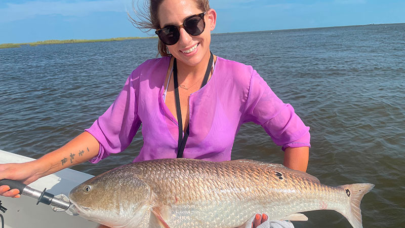 Kelli C. Belanger with a redfish she caught that was around 28 pounds.