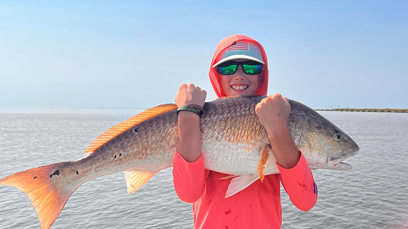 Graham Howard with a bull red caught in Hopedale on a Vudu shrimp.