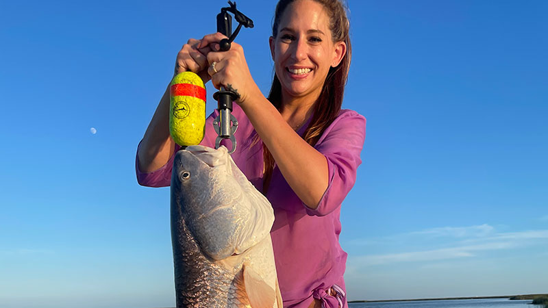 Kelli Chauvin with a 28-pound bull red caught near Wilkerson Bay on July 29.
