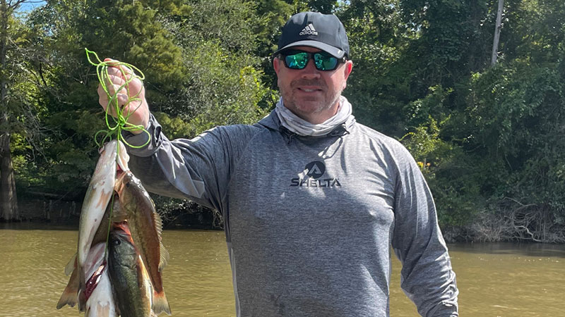 Kelly Guillot with a stringer of bass caught on the West Pearl River.