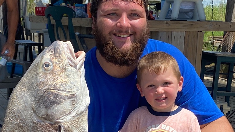Hunter and his son, Grayson Champagne, with a big drum caught in Vermillion Bay with shrimp on the bottom.