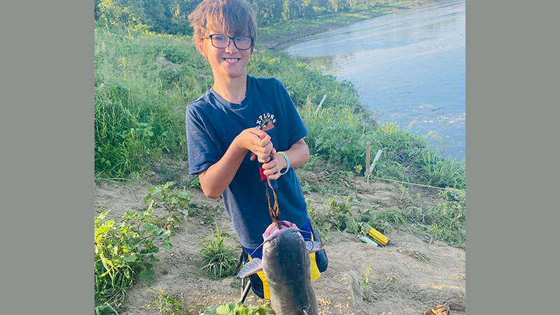 Nathan LeRoy with a catfish caught July 29 in the Mississippi River in St. Francisville.